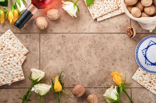Preview: Passover celebration concept. Matzah, kosher red wine, walnut and white and yellow roses. Traditiona