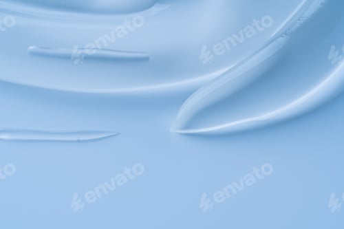 Preview: blue makeup gel swatches with a glossy sheen, photographed on a matching neutral background