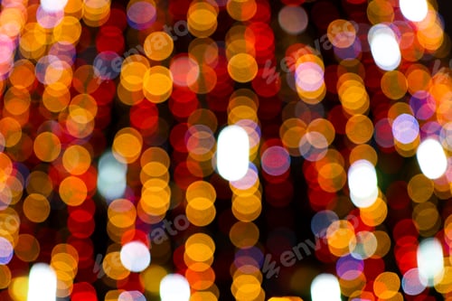 Preview: Festive colored lights defocused on a black background. Abstract background with glowing circles.
