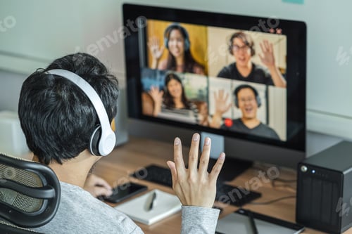 Preview: Rear View of Asian Business man say hello with teamwork colleague in video conference