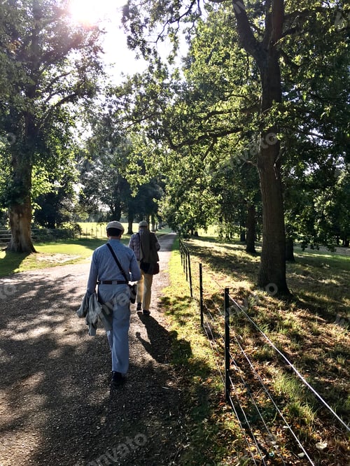 Preview: Two persons walking in nature