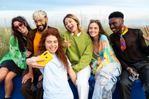 Preview: Group of young trendy gen z friends taking a selfie together