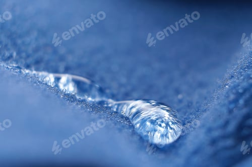 Preview: water beading on fabric. Waterproof coating background with water drops