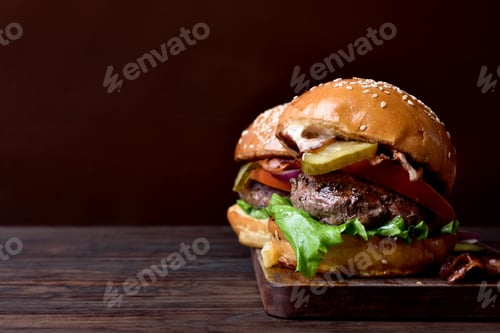Preview: Burger on wooden background with copy space
