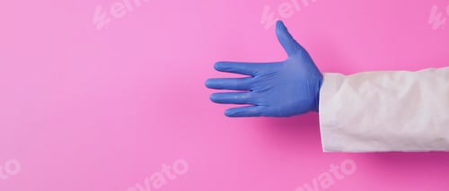 Preview: Gloved Hand Giving a Thumbs Up on Pink