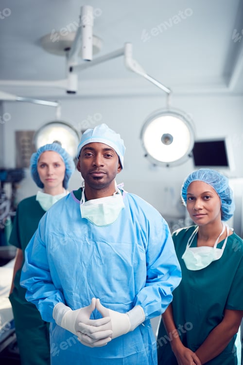 Preview: Portrait Of Multi-Cultural Surgical Team Standing In Hospital Operating Theater