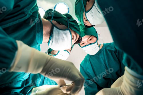 Preview: Surgeons in Teal Scrubs Performing an Operation