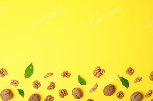 Preview: Flat lay composition with walnuts and space for text on color background