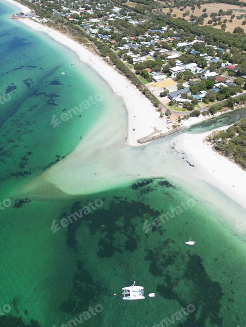 Preview: Aerial view of an idyllic beach city situated on the coast of a picturesque blue ocean