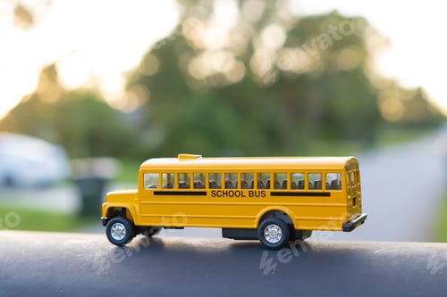Preview: Little model of american yellow school bus outdoor. Concept of education safety in the USA