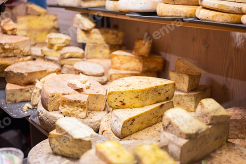 Preview: A variety of cheeses are sold on display at a Christmas market