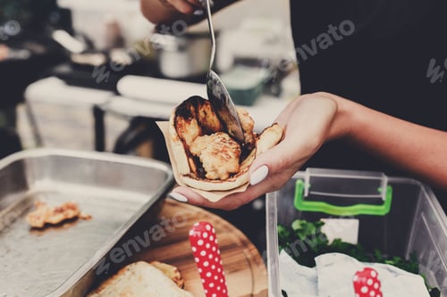 Preview: Fresh Tacos. Selling Mexican Fast Food. Female Street Vendor Hands Put Fillings In Taco Outdoors