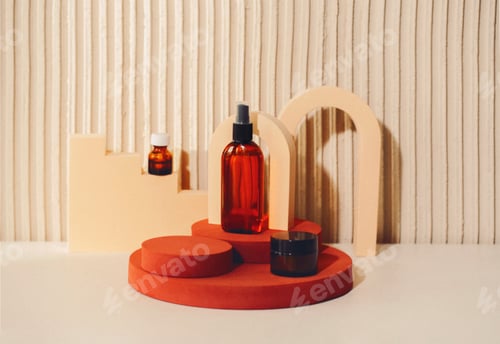 Preview: Abstract composition with cosmetic skincare products in glass bottles standing on round podium