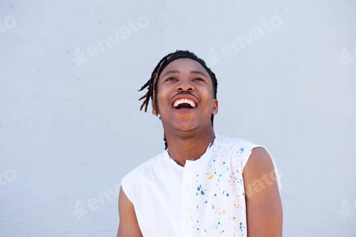 Preview: african man with dreadlocks laughing and looking up