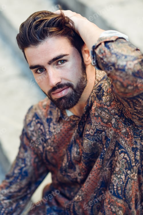 Preview: Young bearded man, model of fashion, wearing shirt in urban back