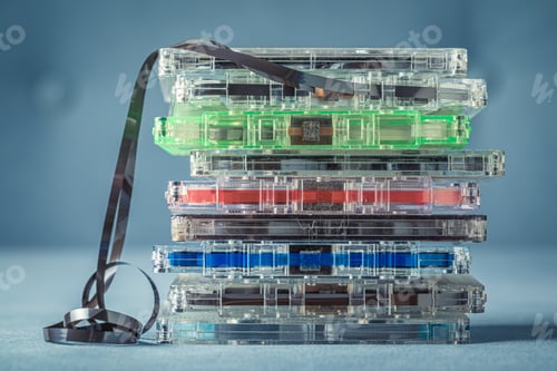 Preview: Pile of retro cassette tapes with an extracted tape