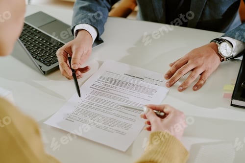 Preview: Signing Business Document on Office Table With Laptop