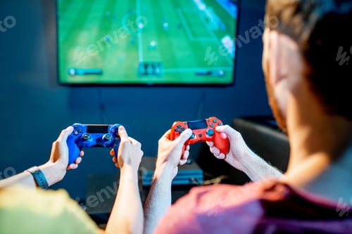 Preview: Couple playing football game with gaming console