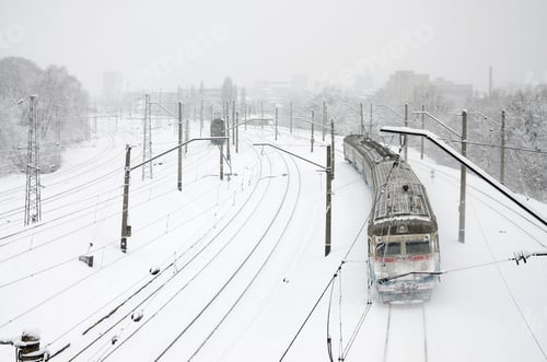 Preview: A long train of passenger cars is moving along the railway track