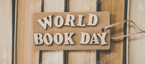 World Book Day Wooden Sign on Book Background