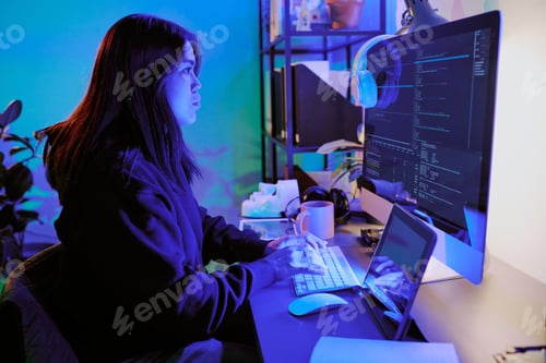 Preview: Woman Coding in Neon room