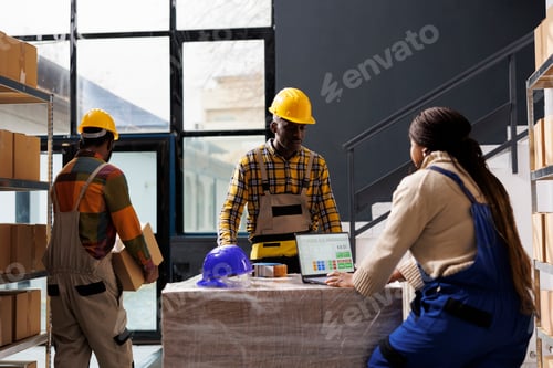 Preview: Warehouse managers checking order information on laptop screen