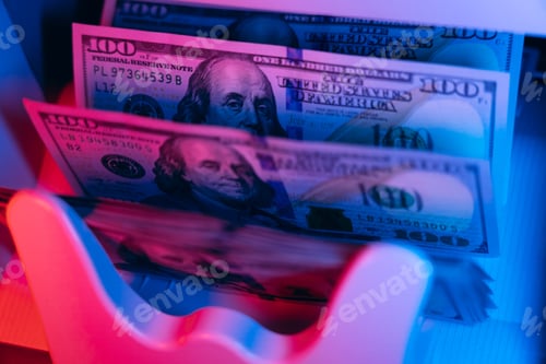 Preview: Money. Machine counting dollars