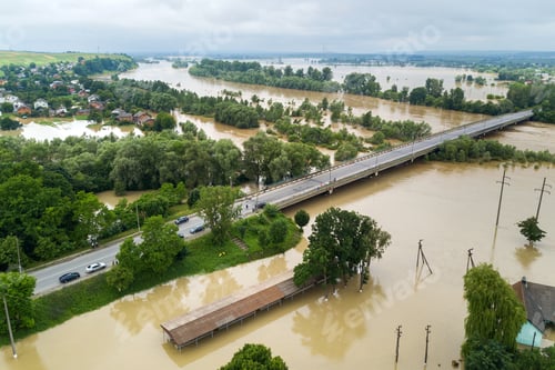 Preview: Aerial view of flooded houses with dirty water of Dnister river in Halych town, western Ukraine.