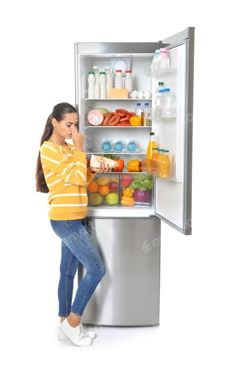 Preview: Young woman with expired cheese near open refrigerator on white background