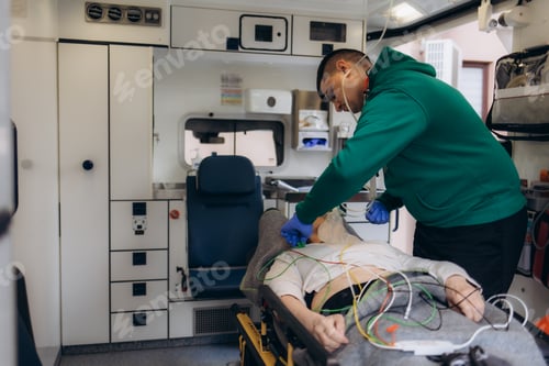 Preview: paramedic healthcare emergency staff taking care of a lying down young woman patient on stretcher
