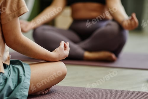 Preview: Mother and Daughter Meditating Closeup