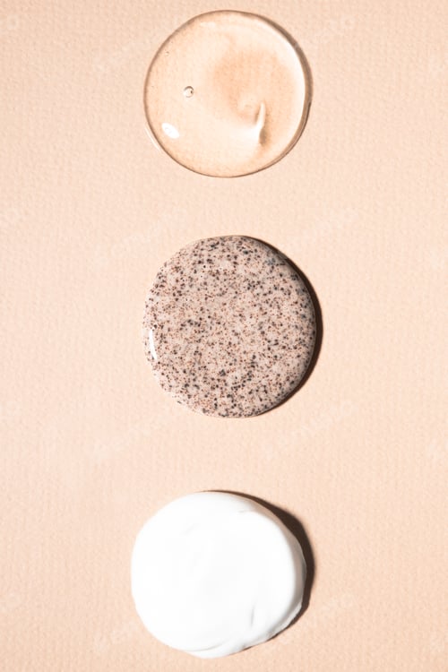 Preview: Samples of cosmetics on a beige background.