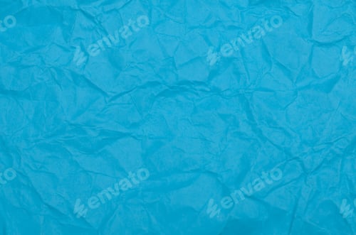 Preview: Dense Texture of Jagged Folds and Soft Creases on Bright Blue Paper Surface