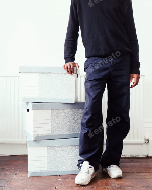 Preview: Man leaning on cardboard boxes