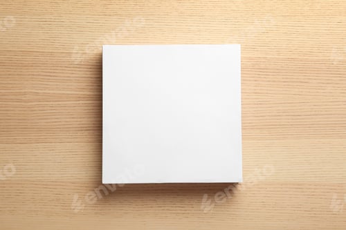 Preview: Stack of blank paper sheets for brochure on wooden background, top view. Mock up