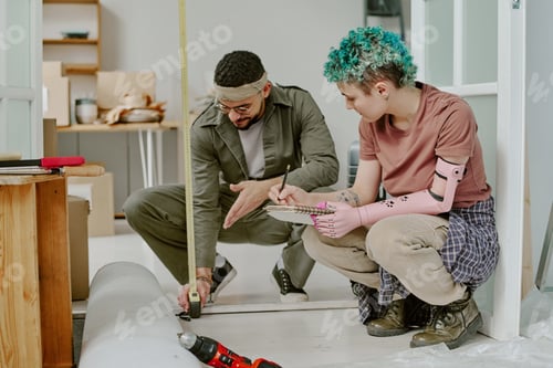 Preview: Couple Measuring Floor While Renovating Apartment