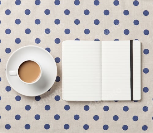 Preview: Cup of coffee and notebook