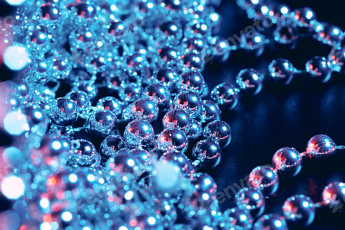 Preview: Party or holiday decoration concept - close up of silver shiny beads