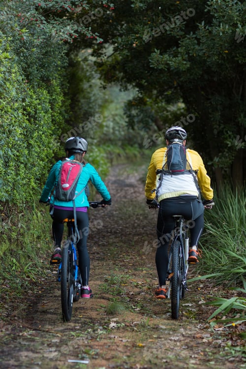 Preview: Biker Couple Cycling In Countryside Forest