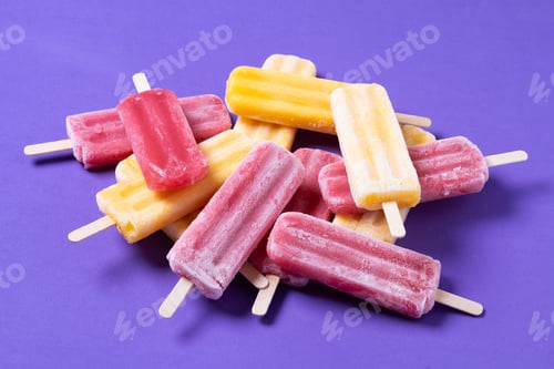 Preview: Red strawberry popsicles and yellow popsicles on purple background