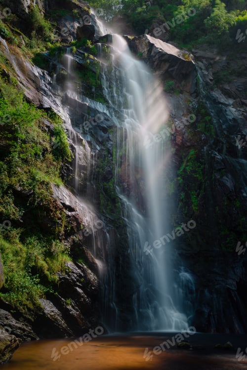 Preview: Some rays of sun cross the waters of the Toxa waterfall