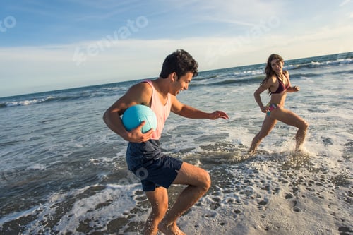 Preview: Young couple fooling around in sea