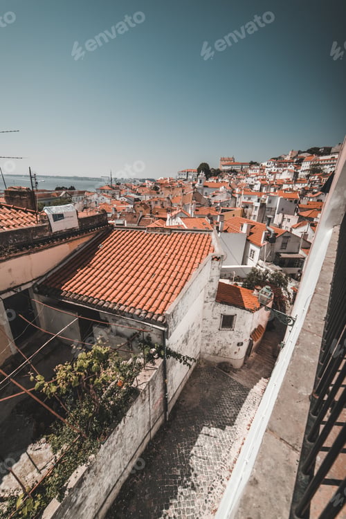 Preview: LISBON, PORTUGAL - MAY 7, 2018: town with orange roofs and square in Lisbon, Portugal