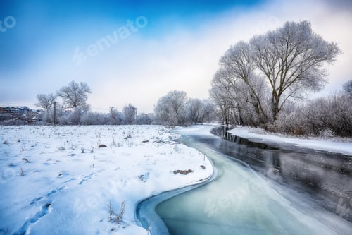Preview: Beautiful Winter landscape scene background with snow covered trees and ice river.