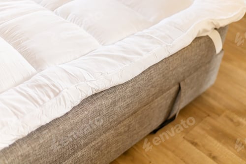 Preview: A mattress topper is on the sofa to provide extra comfort for sleeping.