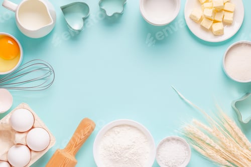 Preview: Ingredients for baking on light blue background.