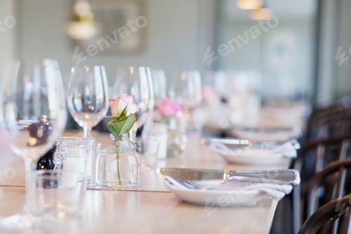 Preview: Elegant table setting at a cozy restaurant awaiting guests.