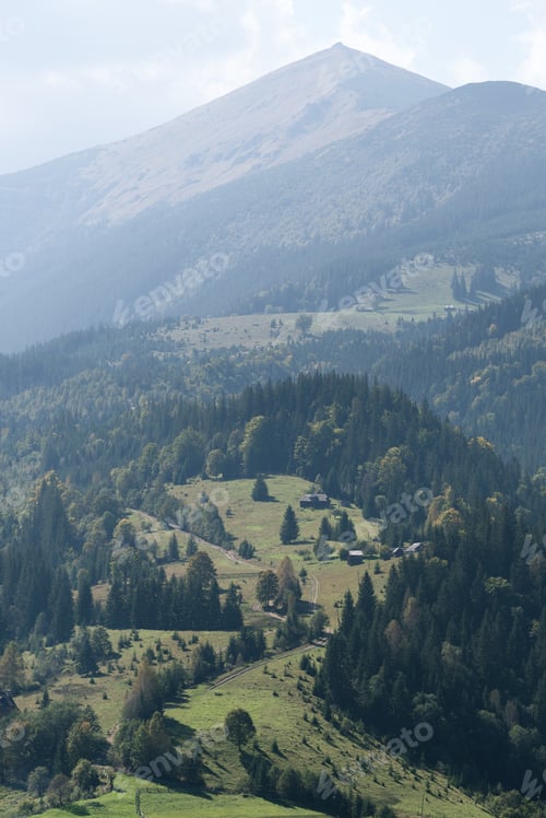 Preview: View of a rural road leading to the mountains