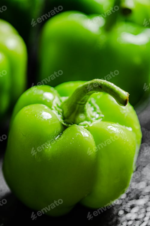 Preview: Fresh sweet pepper. On black table.