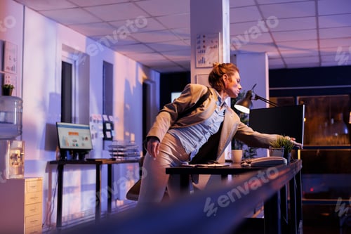 Preview: Executive manager preparing to leave startup office late at night